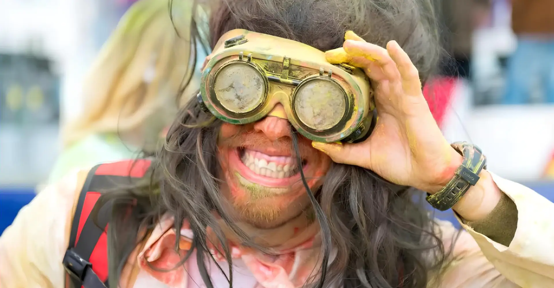 A man looks through binoculars