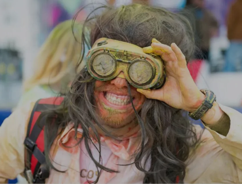 A man holds binoculars in his hands