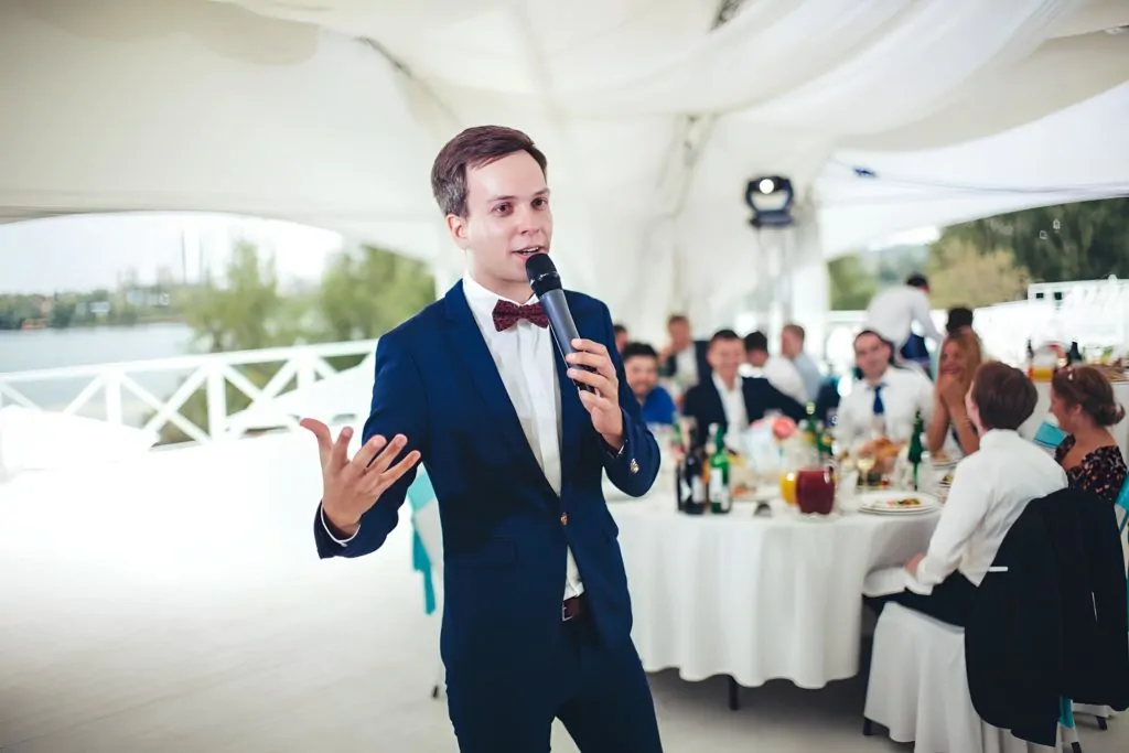 A man in a suit delivers a speech