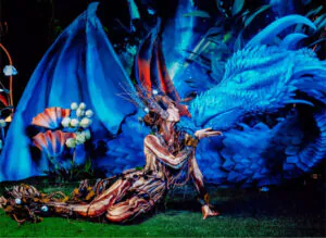 A fabulous creature kisses a blue dragon