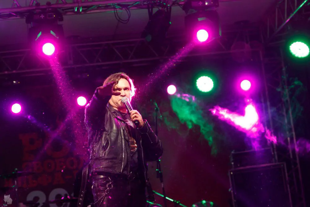 The performer sings on stage