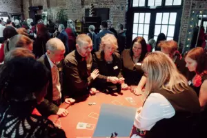 People gathered around the gaming table