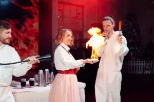 A girl holds a fire on her hand