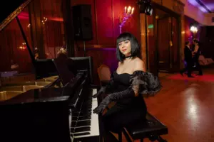 A woman plays the piano