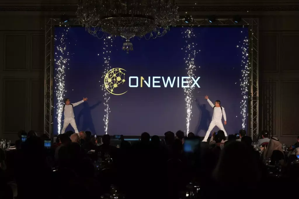 Two actors in white suits