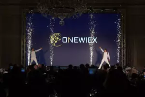 Two actors in white suits