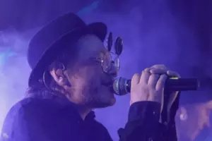 A musician in a black hat