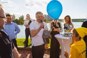 A boy holds a balloon