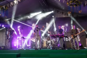 A lively band performs on stage