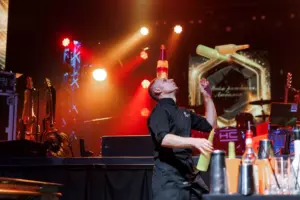 The bartender is juggling bottles