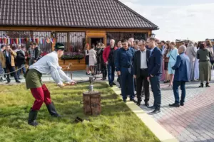 A man hits an anvil with a hammer