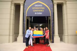 People pose with a flag