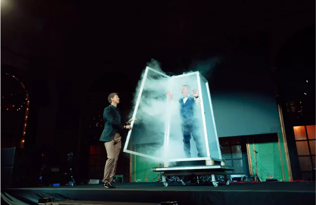 A man stands in a glass cabinet