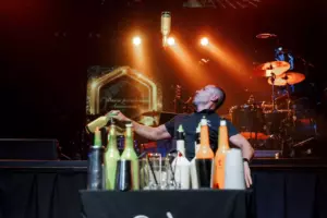 The bartender is juggling bottles