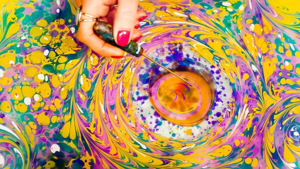 Painting with paints on water