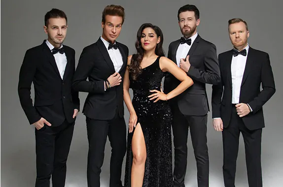 Men in formal suits and woman in black dress