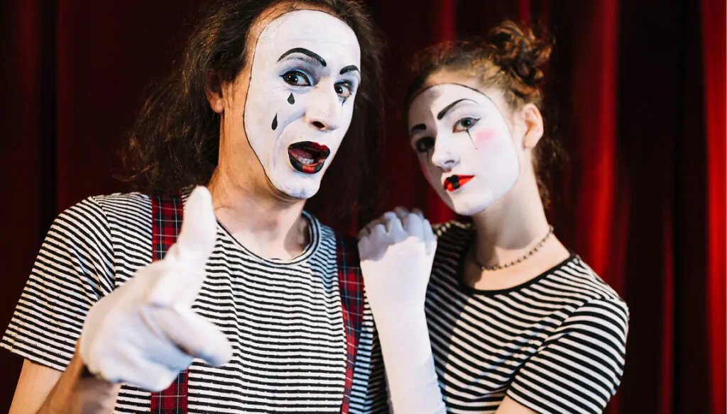 Two performers dressed as mimes, man and woman Two mimes, man and woman