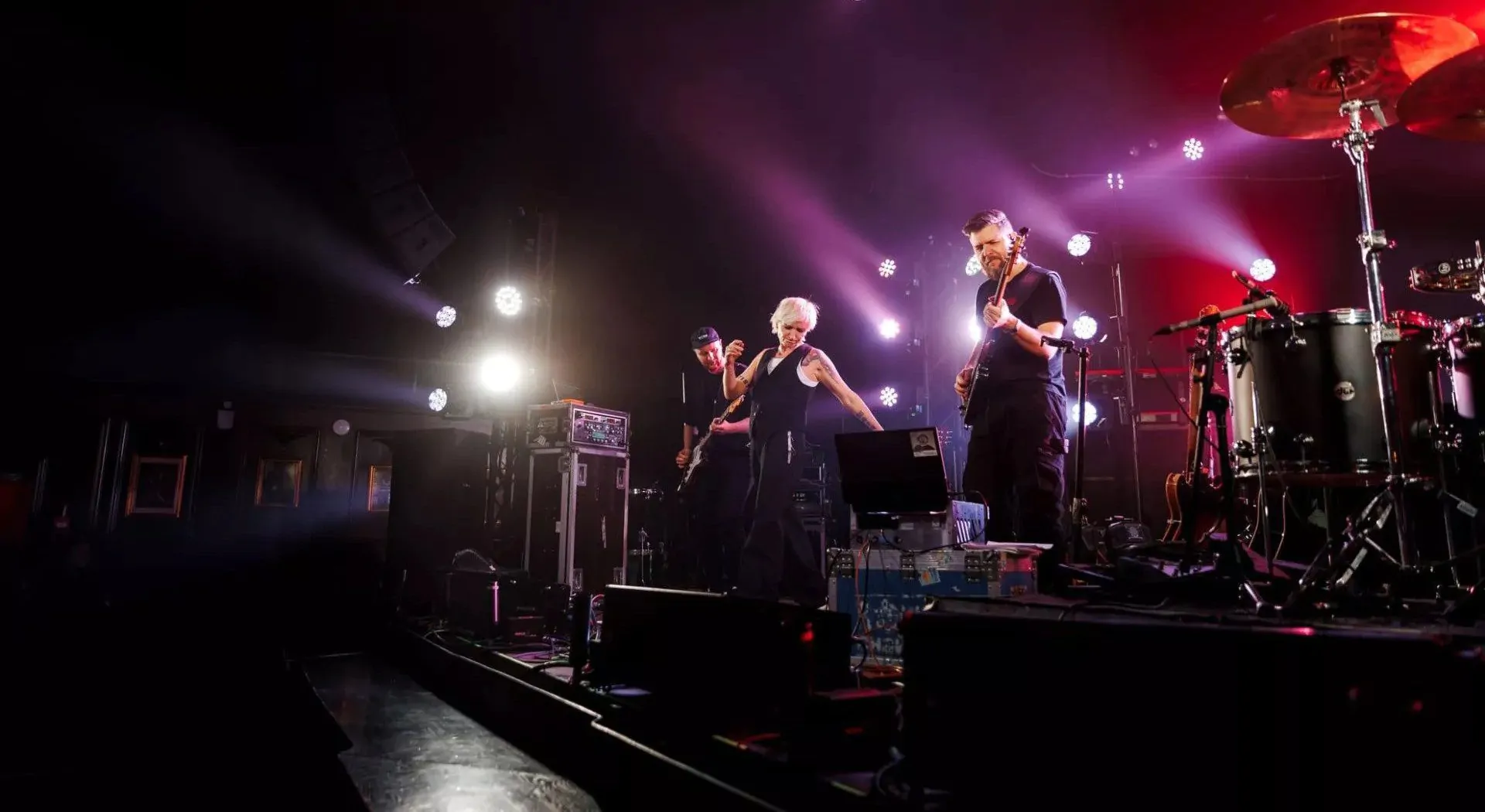 Three-person musical band performing
