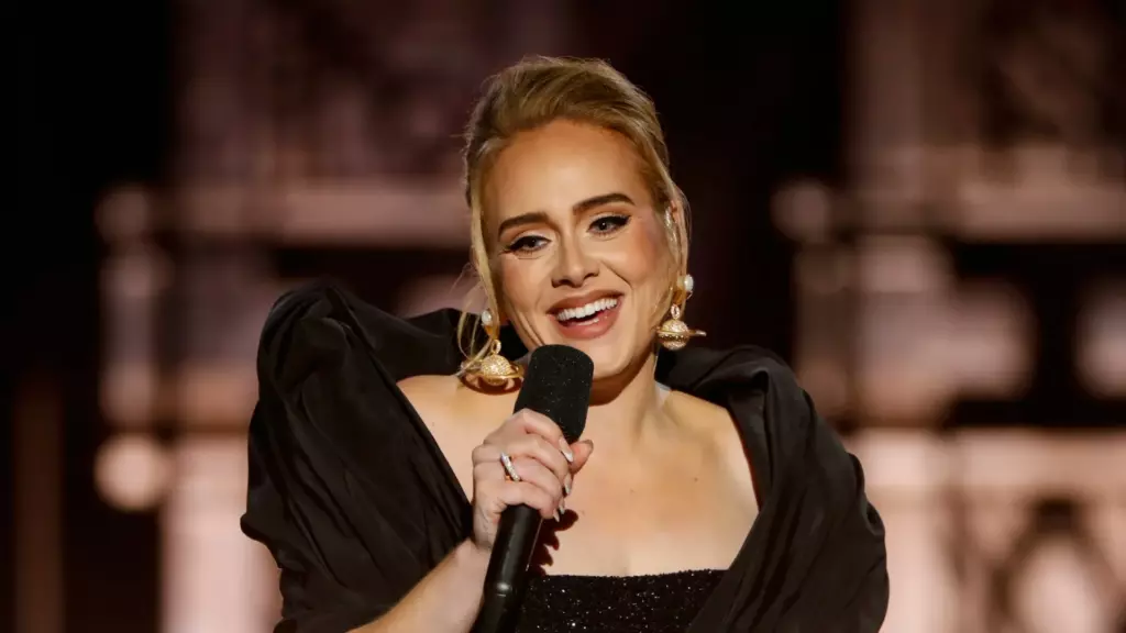 Adele performs on stage Adele